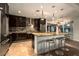 Modern kitchen featuring granite countertops, stainless steel appliances, and an island with seating at 140 E Rio Salado Pkwy # 111, Tempe, AZ 85281