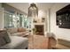 Cozy living room with sectional sofa, fireplace, and large windows at 140 E Rio Salado Pkwy # 111, Tempe, AZ 85281