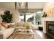Spacious living area featuring a fireplace and plenty of natural light at 140 E Rio Salado Pkwy # 111, Tempe, AZ 85281