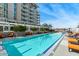 Linear pool with surrounding lounge chairs and building view at 140 E Rio Salado Pkwy # 111, Tempe, AZ 85281
