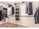 Large walk-in closet with ample shelving and hanging space at 1441 W Flintlock Way, Chandler, AZ 85286