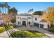 Elegant two-story home with circular driveway and lush landscaping at 1519 E Treasure Cove Dr, Gilbert, AZ 85234