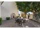 Charming patio area with seating and a tranquil fountain at 1519 E Treasure Cove Dr, Gilbert, AZ 85234