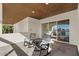 Covered balcony with rocking chairs and water views at 1519 E Treasure Cove Dr, Gilbert, AZ 85234
