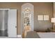 Elegant bedroom with a view of the bathroom and hardwood floors at 1519 E Treasure Cove Dr, Gilbert, AZ 85234