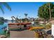 Private boat dock with a covered boat and kayaks at 1519 E Treasure Cove Dr, Gilbert, AZ 85234