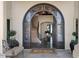 Grand entry with arched stained glass door and elegant staircase at 1519 E Treasure Cove Dr, Gilbert, AZ 85234