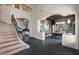 Grand entryway with a sweeping staircase and herringbone floors at 1519 E Treasure Cove Dr, Gilbert, AZ 85234