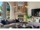 Elegant fireplace with detailed stonework and a large artwork above at 1519 E Treasure Cove Dr, Gilbert, AZ 85234