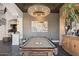 Game room with a pool table, statement art, and a dark wood cabinet at 1519 E Treasure Cove Dr, Gilbert, AZ 85234