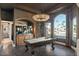 Game room featuring a billiard table, herringbone floors and large windows at 1519 E Treasure Cove Dr, Gilbert, AZ 85234