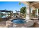 Inviting hot tub on a patio with lake and landscape views at 1519 E Treasure Cove Dr, Gilbert, AZ 85234