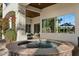 Spacious hot tub on patio, with large windows offering water views at 1519 E Treasure Cove Dr, Gilbert, AZ 85234