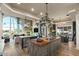 Open kitchen with expansive island and views to living room and water at 1519 E Treasure Cove Dr, Gilbert, AZ 85234