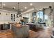 Bright kitchen with an expansive island, stainless steel appliances, and hardwood floors at 1519 E Treasure Cove Dr, Gilbert, AZ 85234