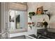 Bright laundry room with washer, dryer, and glass shelves at 1519 E Treasure Cove Dr, Gilbert, AZ 85234