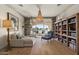 Cozy library with built-in bookshelves and a view of the water at 1519 E Treasure Cove Dr, Gilbert, AZ 85234