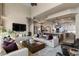Living room with open concept to kitchen, featuring hardwood floors at 1519 E Treasure Cove Dr, Gilbert, AZ 85234