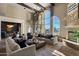 Spacious living area with hardwood floors,water views, and access to other rooms at 1519 E Treasure Cove Dr, Gilbert, AZ 85234