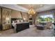 Luxurious main bedroom with a king-size bed, fireplace, and water views at 1519 E Treasure Cove Dr, Gilbert, AZ 85234