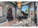 Bright music room with grand piano, comfortable seating, and hardwood floors at 1519 E Treasure Cove Dr, Gilbert, AZ 85234