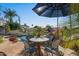 Charming patio table set with lake views and umbrella for shade at 1519 E Treasure Cove Dr, Gilbert, AZ 85234