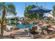 Relaxing poolside lounge chairs with views of the lake and landscaping at 1519 E Treasure Cove Dr, Gilbert, AZ 85234