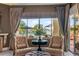 Waterfront sitting area with comfy chairs, offering stunning lake views at 1519 E Treasure Cove Dr, Gilbert, AZ 85234