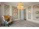 Elegant sitting room featuring a comfortable armchair and stylish decor at 1519 E Treasure Cove Dr, Gilbert, AZ 85234