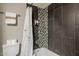 Bathroom with shower/tub, tile surround, and white vanity at 1637 N Bridalwreath St, Tempe, AZ 85288