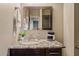Bathroom with granite countertop, vanity, and mirror at 1637 N Bridalwreath St, Tempe, AZ 85288