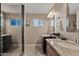 Bathroom boasts double vanity and granite countertops at 1637 N Bridalwreath St, Tempe, AZ 85288