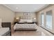 Main bedroom with king-size bed and private access at 1637 N Bridalwreath St, Tempe, AZ 85288