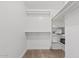 Large walk-in closet with shelving and rods at 1637 N Bridalwreath St, Tempe, AZ 85288