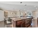 Open kitchen with granite island and dark wood cabinets at 1637 N Bridalwreath St, Tempe, AZ 85288