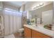 Clean bathroom with single sink vanity and shower/tub combo at 16916 W Eureka Springs Dr, Surprise, AZ 85387