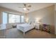 Comfortable bedroom with ceiling fan and ample natural light at 16916 W Eureka Springs Dr, Surprise, AZ 85387