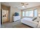 Spacious bedroom with a dresser and large window at 16916 W Eureka Springs Dr, Surprise, AZ 85387