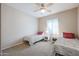 Cozy bedroom with twin beds and plenty of natural light at 16916 W Eureka Springs Dr, Surprise, AZ 85387