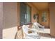 Inviting front porch with two white chairs, perfect for relaxing at 16916 W Eureka Springs Dr, Surprise, AZ 85387