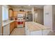 Well-equipped kitchen with ample counter space and wood cabinets at 16916 W Eureka Springs Dr, Surprise, AZ 85387