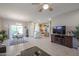 Open concept kitchen and dining area with stainless steel appliances and tile flooring at 16916 W Eureka Springs Dr, Surprise, AZ 85387