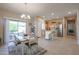 Open floor plan kitchen and dining area with tile flooring at 16916 W Eureka Springs Dr, Surprise, AZ 85387