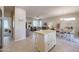 Open concept kitchen and dining area with island and breakfast bar at 16916 W Eureka Springs Dr, Surprise, AZ 85387