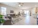 Spacious living room with comfortable seating and neutral colors at 16916 W Eureka Springs Dr, Surprise, AZ 85387
