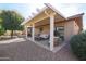 Covered patio with seating area and view of the backyard at 16916 W Eureka Springs Dr, Surprise, AZ 85387