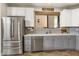 Modern kitchen with stainless steel appliances and gray and white cabinets at 17025 E La Montana Dr # 130, Fountain Hills, AZ 85268
