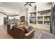 Open concept living area showcasing a modern kitchen and comfortable leather seating at 17025 E La Montana Dr # 130, Fountain Hills, AZ 85268