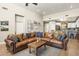 Spacious living room with a large leather sectional sofa and wood coffee table at 17025 E La Montana Dr # 130, Fountain Hills, AZ 85268