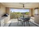 Private balcony with outdoor dining set, grill, and mountain views at 17025 E La Montana Dr # 130, Fountain Hills, AZ 85268